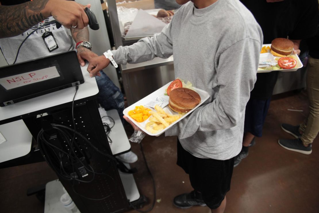 A child receives a meal at the Casa Padre shelter in Brownsville, Texas.