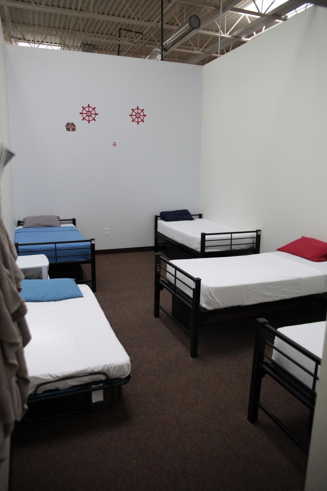 Five cot-like beds have been squeezed into bedrooms built originally for four at the shelter.