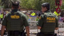 CALEXICO, CA - APRIL 18: Border agents watch as protesters on the Mexico side of the border demonstrate against policies of President Donald Trump while U.S. Department of Homeland Security Secretary Kirstjen Nielsen tours a replacement border fence construction site on April 18, 2018 in Calexico, California. President Trump recently bashed  California Gov. Jerry Brown after a decision to limit the mission of California National Guard troops at the Mexico border.  (Photo by David McNew/Getty Images)