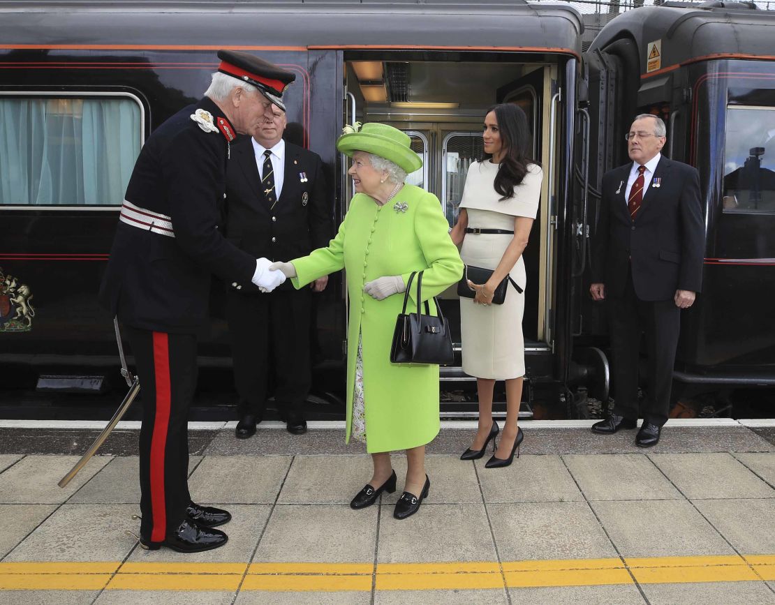 Queen Elizabeth II and the Duchess of Sussex arrive in Cheshire on Thursday.