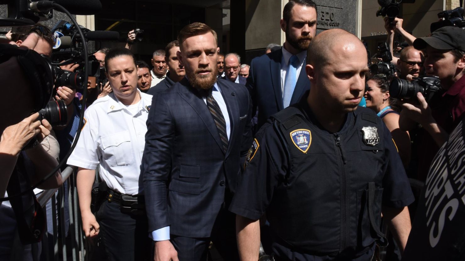 Mixed martial arts fighter Conor McGregor leaves a court in Brooklyn, New York, on Thursday after a brief hearing.