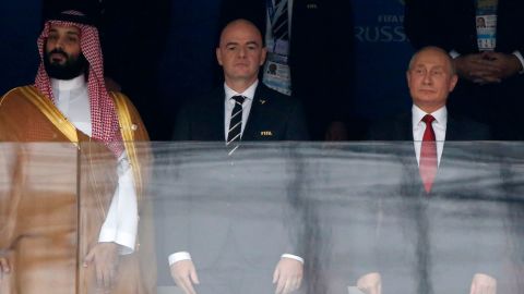 FIFA President Gianni Infantino, second from left, and Russian President Vladimir Putin, second from right, stand for the anthems prior to kick-off.