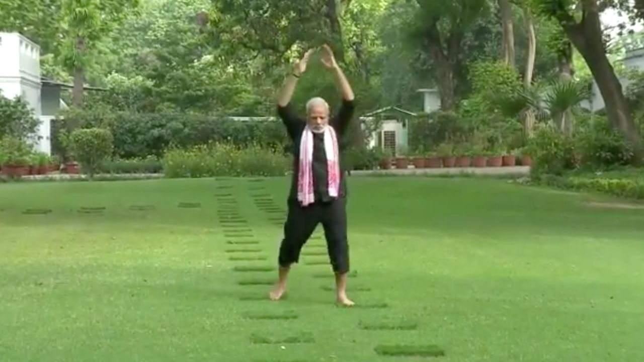 Indian Prime Minister Modi is shown practicing his yoga in the garden during his morning exercise routine