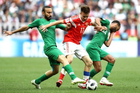 Fedor Smolov fights off two Saudi defenders during the tournament opener, which Russia won 3-0 on June 14. Russia and Saudi Arabia came into the match as the lowest-ranked teams in the tournament.