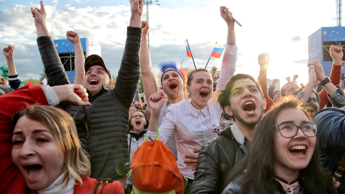 Fans celebrate after Russia scored the first goal in the opening match