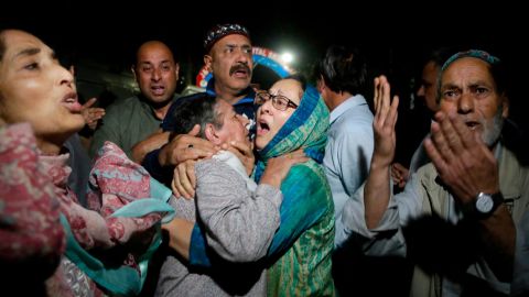 Relatives and friends of journalist Shujaat Bukhari cry inside a police control room in Srinagar, India, Thursday, June 14, 2018.  Mukhtar Khan/AP