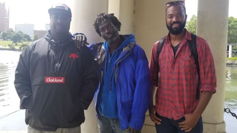 Kenzie Smith (left), Drew (middle) and JJ Harris (center) pose for a photo near Lake Merritt.