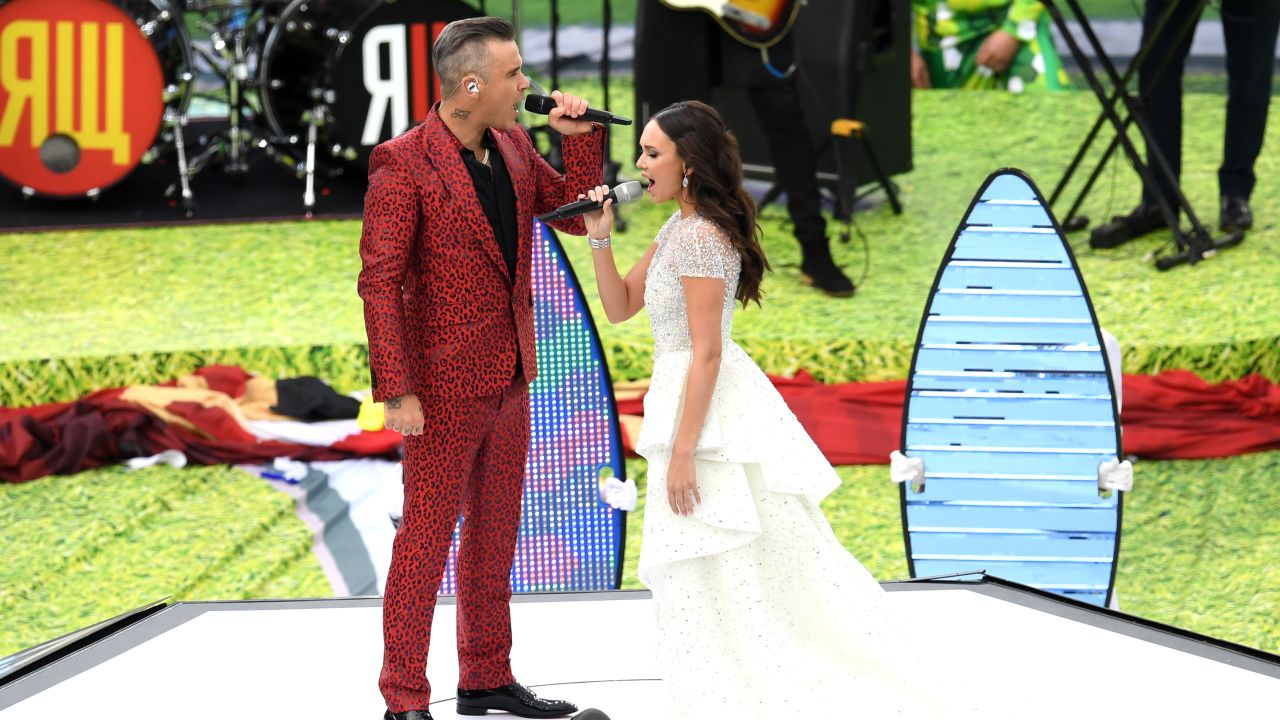 Robbie Williams and Aida Garifullina perform during the opening ceremony.