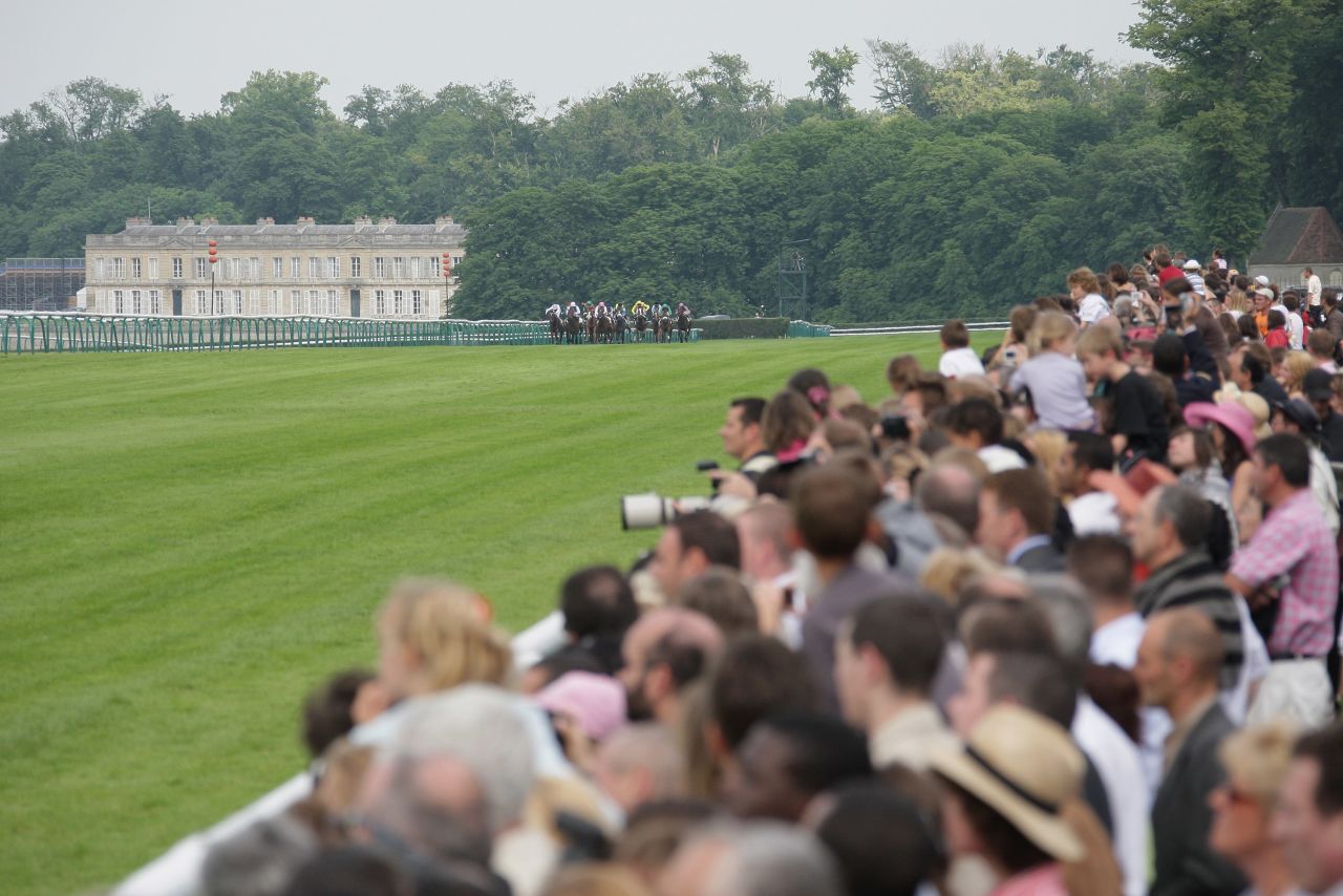 The Hippodrome de Chantilly features three interlinked tracks surrounded by woodland in France's main horse racing center. The first race was held here in 1834 with the grandstand added in 1879.