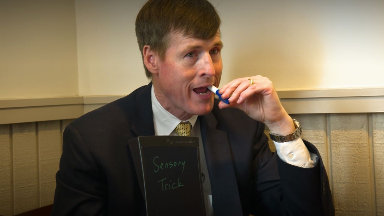 Sensory tricks, like putting a pen in his mouth, helps Dupree speak more words.