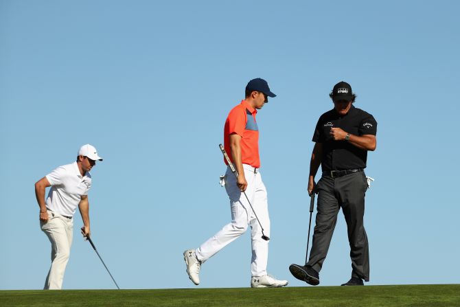 Rory McIlroy (left), Jordan Spieth (center) and Phil Mickelson formed a big-name trio on Thursday morning but the supergroup couldn't hit the right notes.