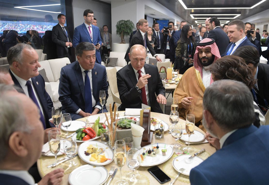 Putin and Mohammed bin Salman (R) take a break at half-time of the Russia-Saudi Arabia match.