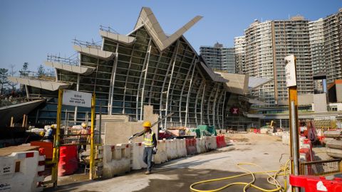 A worker walks outside the West Kowloon station of the Express Rail Link train to Guangzhou in Hong Kong on March 23.