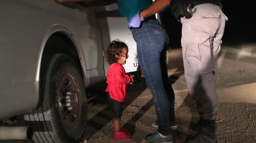 MCALLEN, TX - JUNE 12: A two-year-old Honduran asylum seeker cries as her mother is searched and detained near the U.S.-Mexico border on June 12, 2018 in McAllen, Texas. The asylum seekers had rafted across the Rio Grande from Mexico and were detained by U.S. Border Patrol agents before being sent to a processing center for possible separation. Customs and Border Protection (CBP) is executing the Trump administration's "zero tolerance" policy towards undocumented immigrants. U.S. Attorney General Jeff Sessions also said that domestic and gang violence in immigrants' country of origin would no longer qualify them for political asylum status.  (Photo by John Moore/Getty Images)