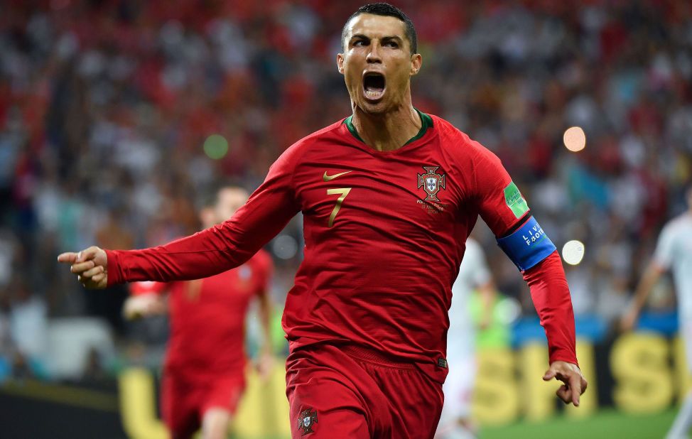 Portugal star Cristiano Ronaldo celebrates his first-half penalty against Spain on June 15. He added two more goals in the 3-3 draw.