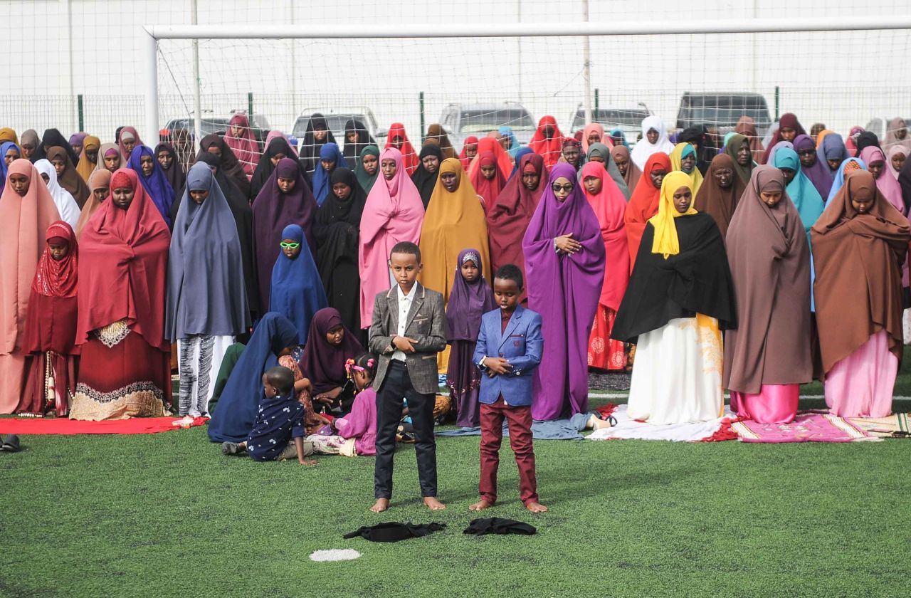 Somalis take part in Eid al-Fitr prayers on a football pitch in Mogadishu.