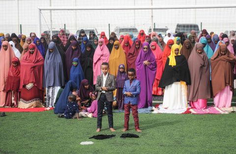 Somalis take part in Eid al-Fitr prayers on a football pitch in Mogadishu.