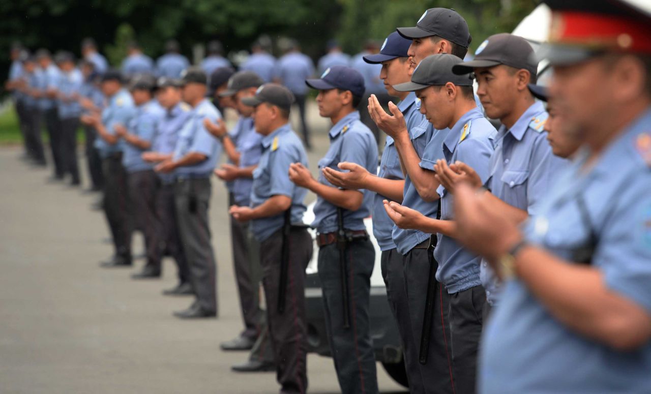 Police officers pray in Bishkek, Kyrgyzstan.