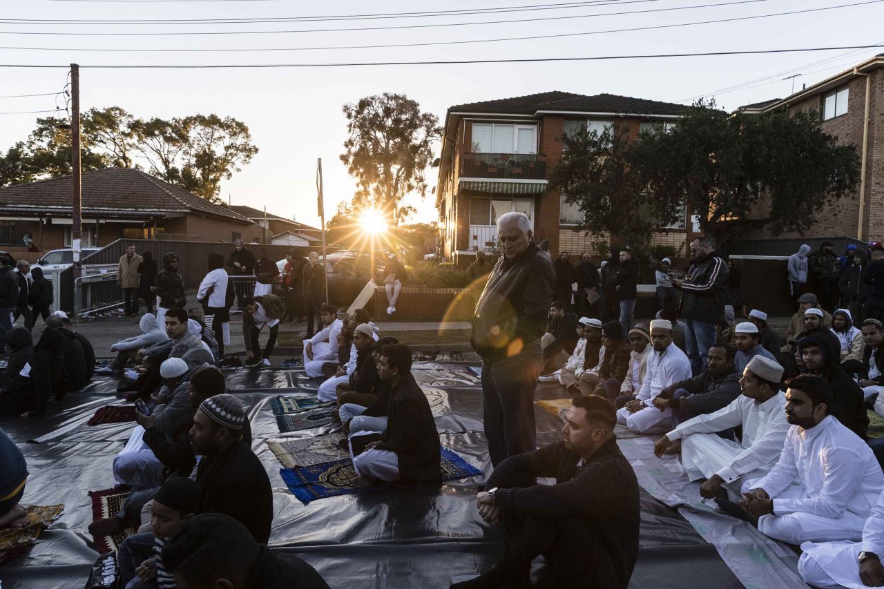 A crowd gathers to pray outside the Lakemba Mosque in Sydney.