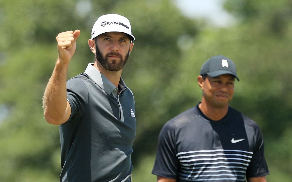 <strong>Day two:</strong> Then and now. World No.1 Dustin Johnson led by four at halfway as former top-ranked Tiger Woods missed the cut at Shinnecock Hills. 