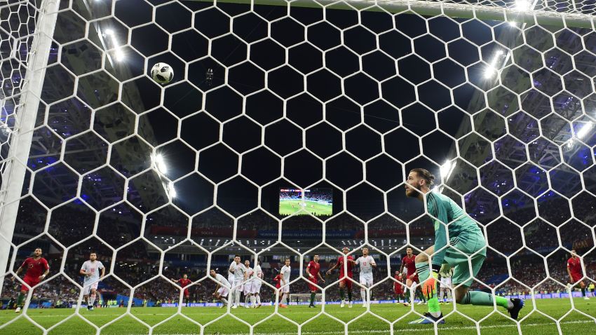 Spain's goalkeeper David De Gea watches as a freekick taken by Portugal's forward Cristiano Ronaldo goes into the net during the Russia 2018 World Cup Group B football match between Portugal and Spain at the Fisht Stadium in Sochi on June 15, 2018. (Photo by PIERRE-PHILIPPE MARCOU / AFP) / RESTRICTED TO EDITORIAL USE - NO MOBILE PUSH ALERTS/DOWNLOADS        (Photo credit should read PIERRE-PHILIPPE MARCOU/AFP/Getty Images)