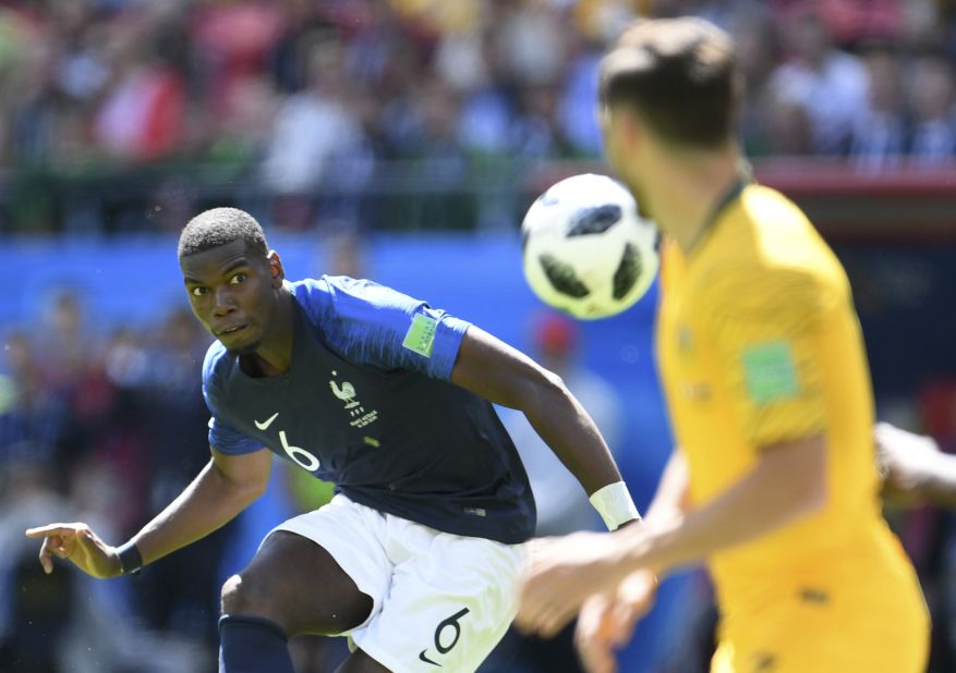French midfielder Paul Pogba keeps his eye on the ball against Australia. His shot deflected off an Australian for the match-winning goal.