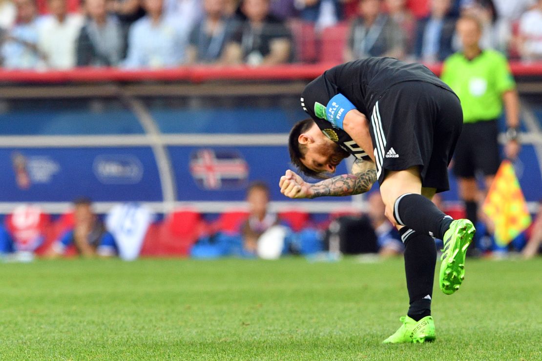 Lionel Messi reacts in frustration after missing a penalty.