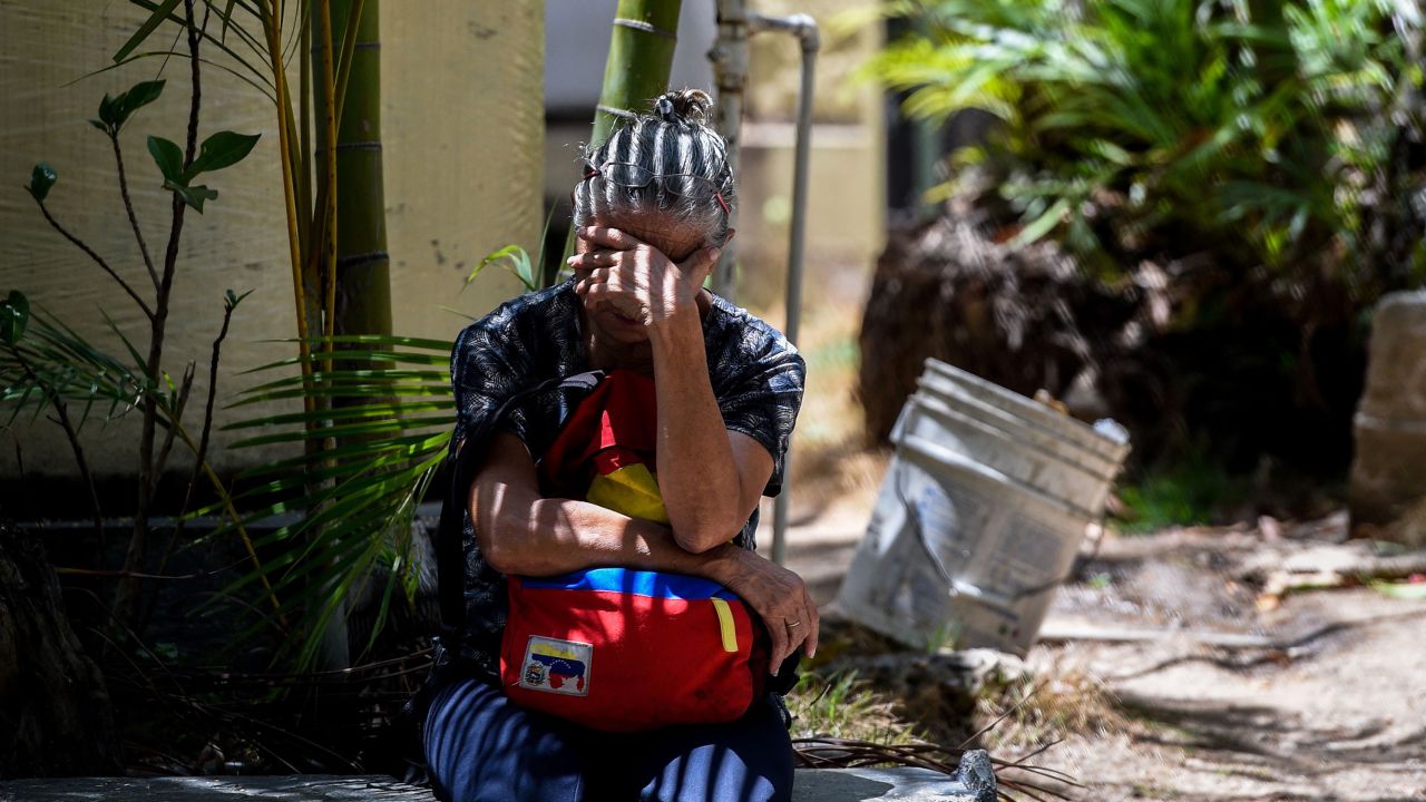 A relative of one of the victims of the night club "Los Cotorros" -where a tear gas grenade was detonated- waits outside the morgue in Caracas on June 16, 2018. - Seventeen people, including eight minors, were killed after a brawl broke out during a middle school graduation party and someone detonated the tear gas, sending more than 500 people rushing for the exits (Photo by Federico PARRA / AFP)        (Photo credit should read FEDERICO PARRA/AFP/Getty Images)