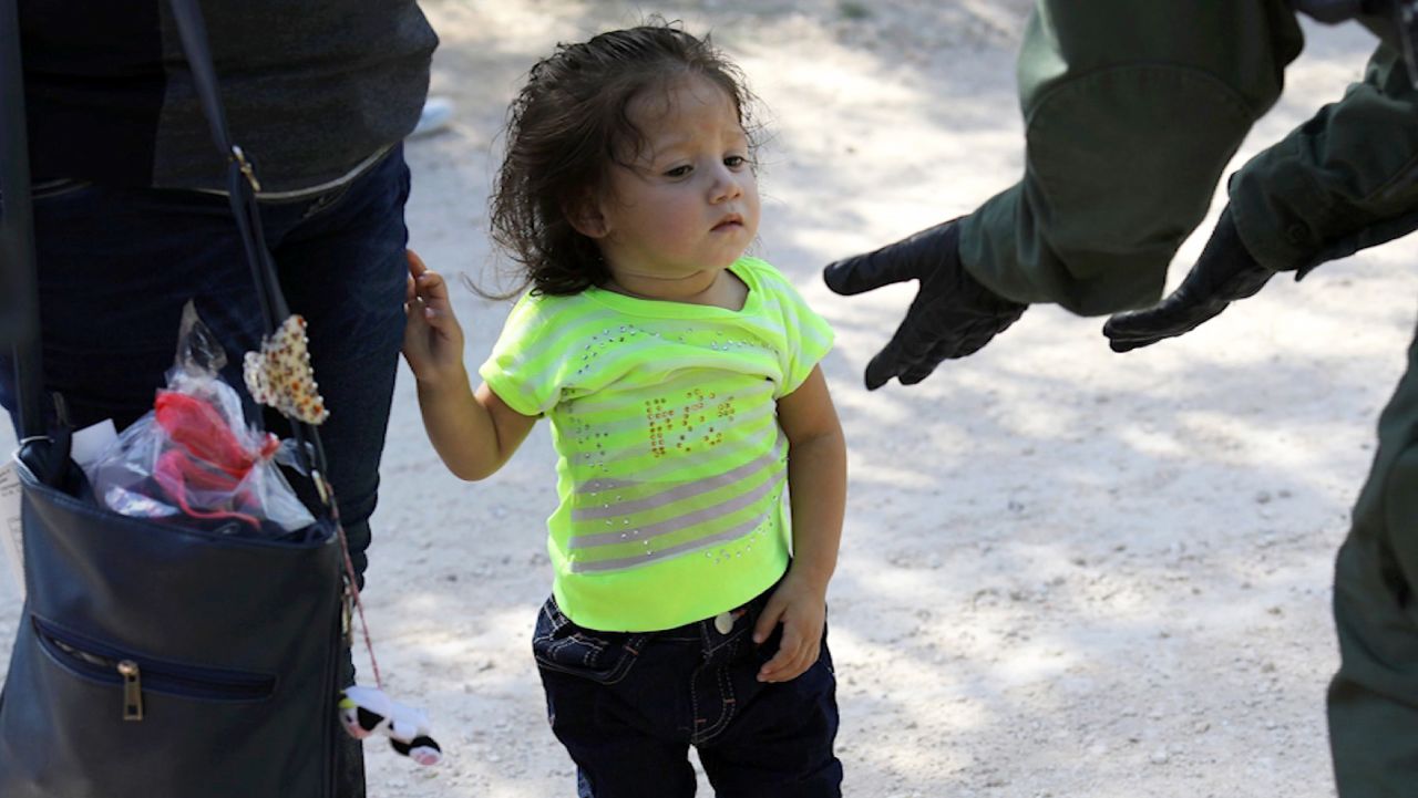 Border Patrol Agents Detain Migrants Near US-Mexico Border MISSION, TX - JUNE 12: U.S. Border Patrol agents take into custody a father and son from Honduras near the U.S.-Mexico border on June 12, 2018 near Mission, Texas. The asylum seekers were then sent to a U.S. Customs and Border Protection (CBP) processing center for possible separation. U.S. border authorities are executing the Trump administration's zero tolerance policy towards undocumented immigrants. U.S. Attorney General Jeff Sessions also said that domestic and gang violence in immigrants' country of origin would no longer qualify them for political-asylum status. (Photo by John Moore/Getty Images)