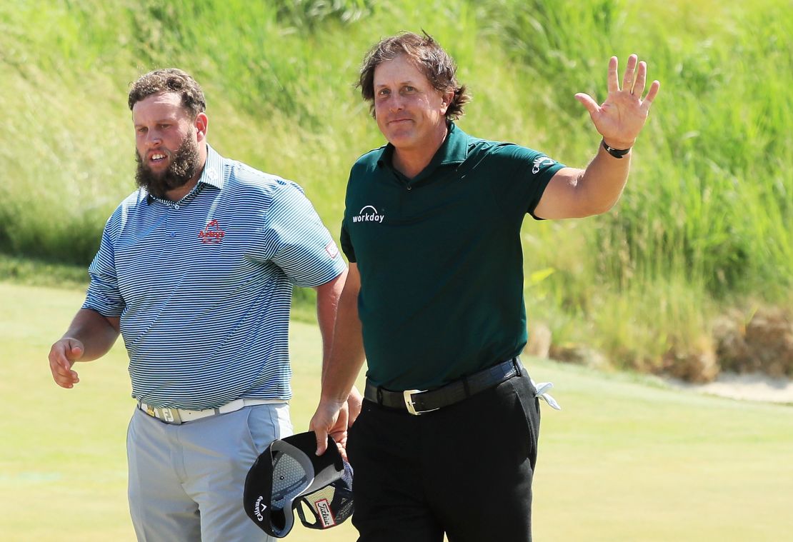 Phil Mickelson (right) played with England's Andrew Johnston Saturday.
