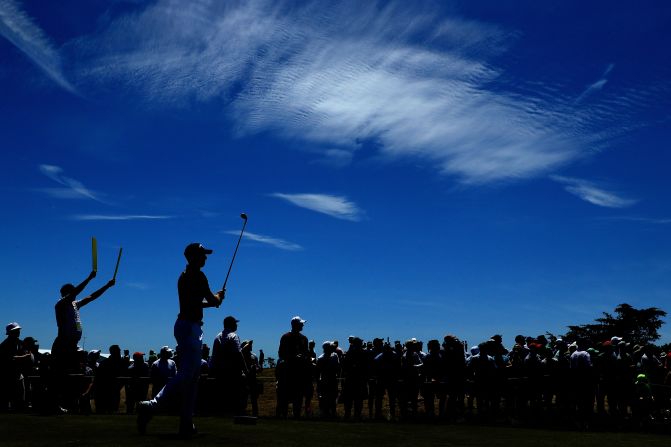 American Daniel Berger shot a four-under 66 in favorable conditions Saturday morning and jumped up the leaderboard when the later starters struggled in stronger winds.