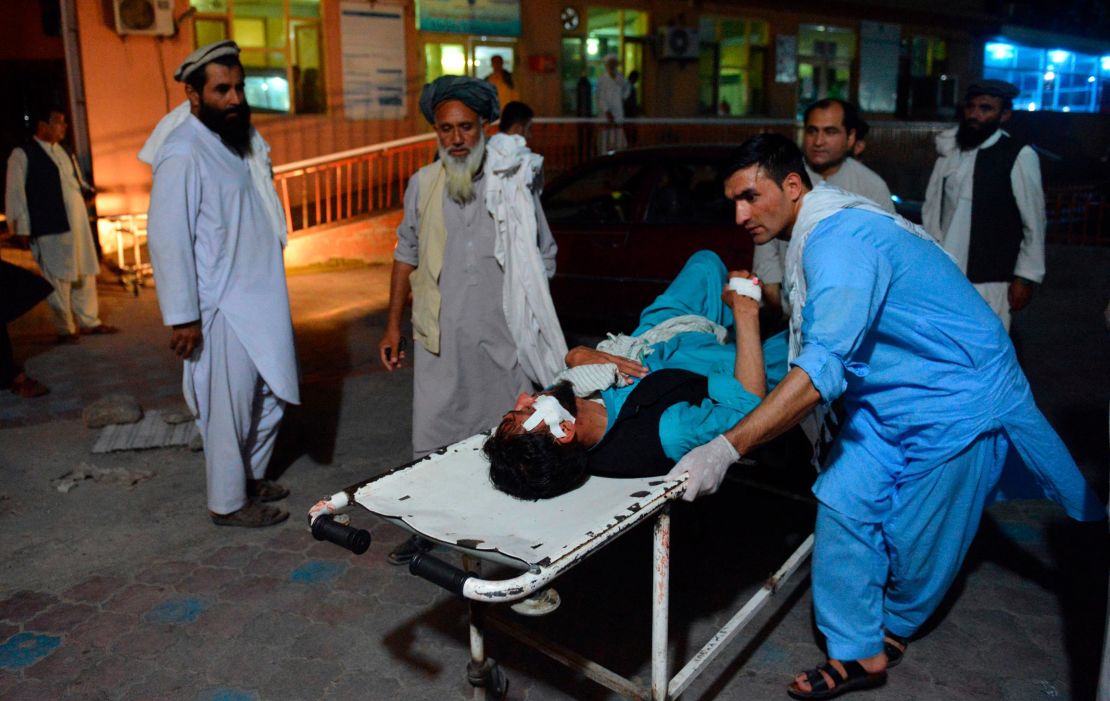 An injured man is brought by stretcher on June 16, into a hospital in Jalalabad, Afghanistan.