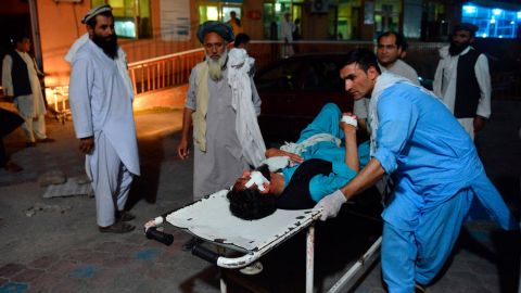 An injured man is brought by stretcher on June 16, into a hospital in Jalalabad, Afghanistan.