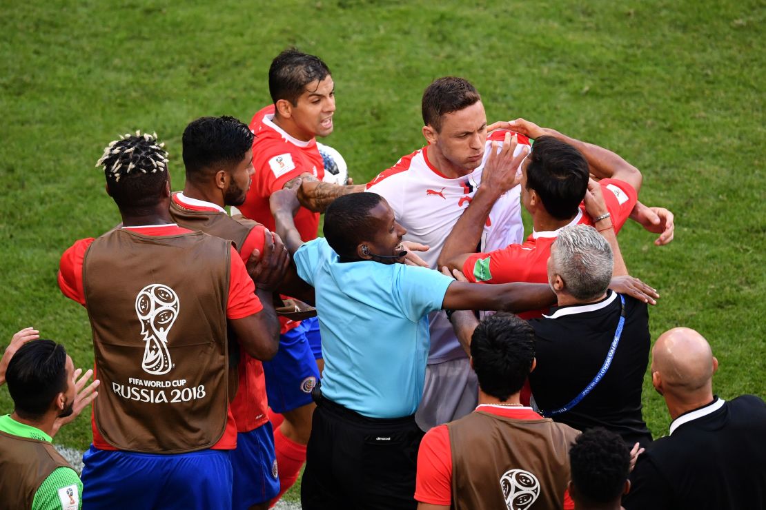 Serbia midfielder Nemanja Matic confronts Costa Rica players following an altercation with one of the coaches.