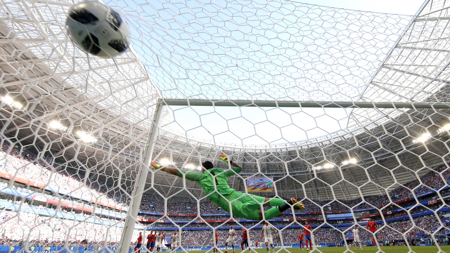 Costa Rica goalkeeper Keylor Navas fails to prevent Aleksandar Kolarov's stunning free-kick from finding the back of the net.