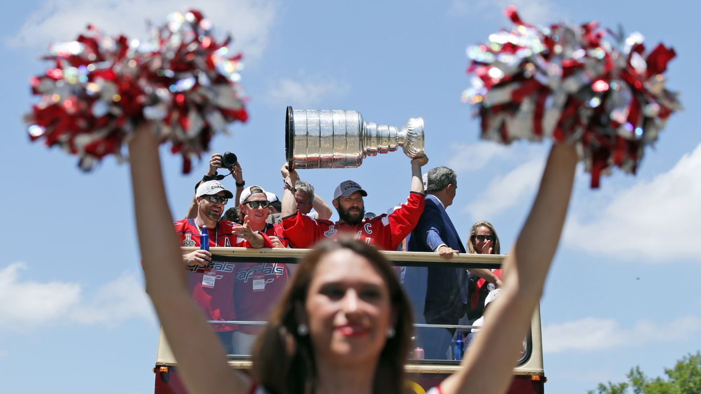 Washington Capitals captain Alex Ovechkin holds up the Stanley Cup during the hockey team's victory parade on Tuesday, June 12. It is the first championship in the franchise's 44-year history.