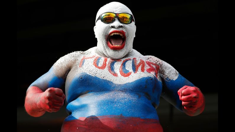 A soccer fan wears body paint in Russia's colors before the opening match of the World Cup on Thursday, June 14. Russia, the tournament's host nation, defeated Saudi Arabia 5-0.
