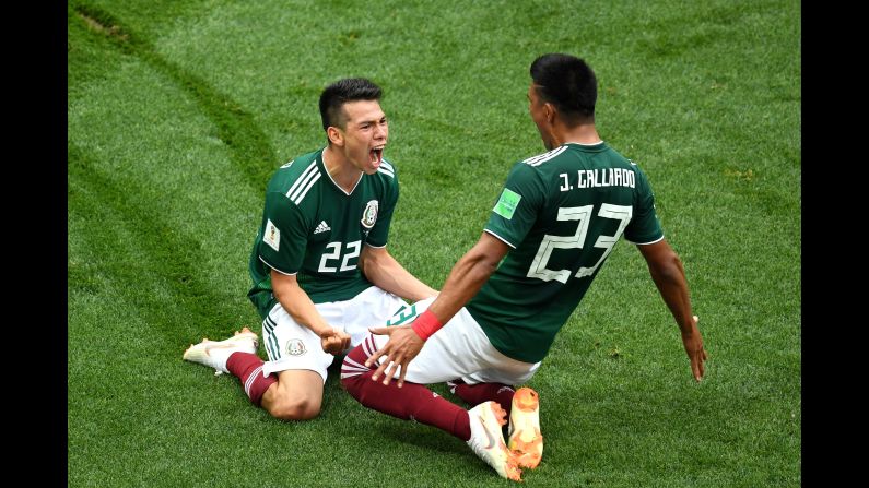 Hirving Lozano of Mexico celebrates with Jesus Gallardo after scoring his team's first goal against Germany during a World Cup match on Sunday, June 17. In a stunning upset, Mexico defeated defending World Cup champion Germany 1-0. 