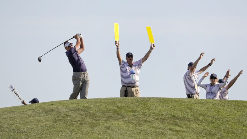 Ian Poulter of England plays his shot from the 12th tee during the third round of the US Open Golf Championship, on Saturday, June 16.