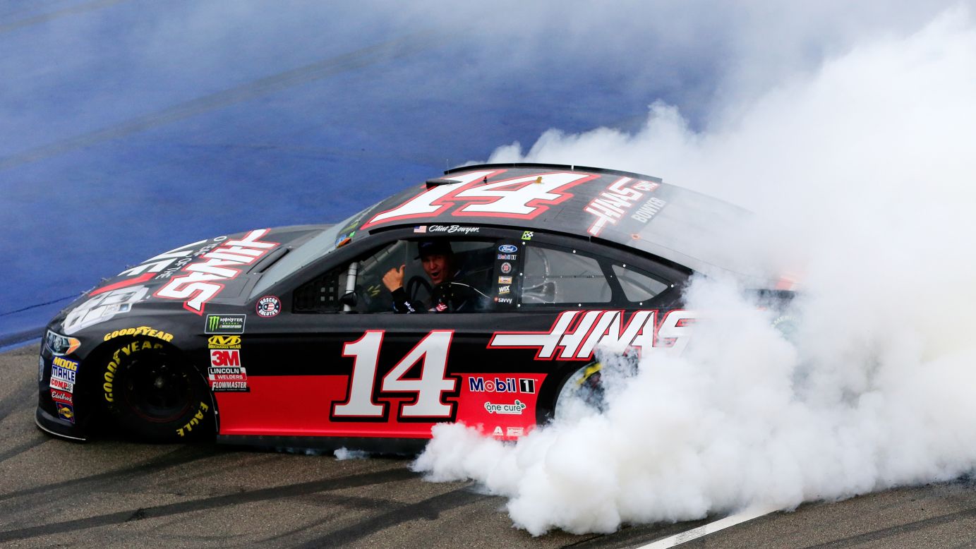 Clint Bowyer, driver of the #14 Haas 30 Years of the VF1 Ford, celebrates with a burnout after winning the Monster Energy NASCAR Cup Series FireKeepers Casino 400 on Sunday, June 10 in Brooklyn, Michigan.