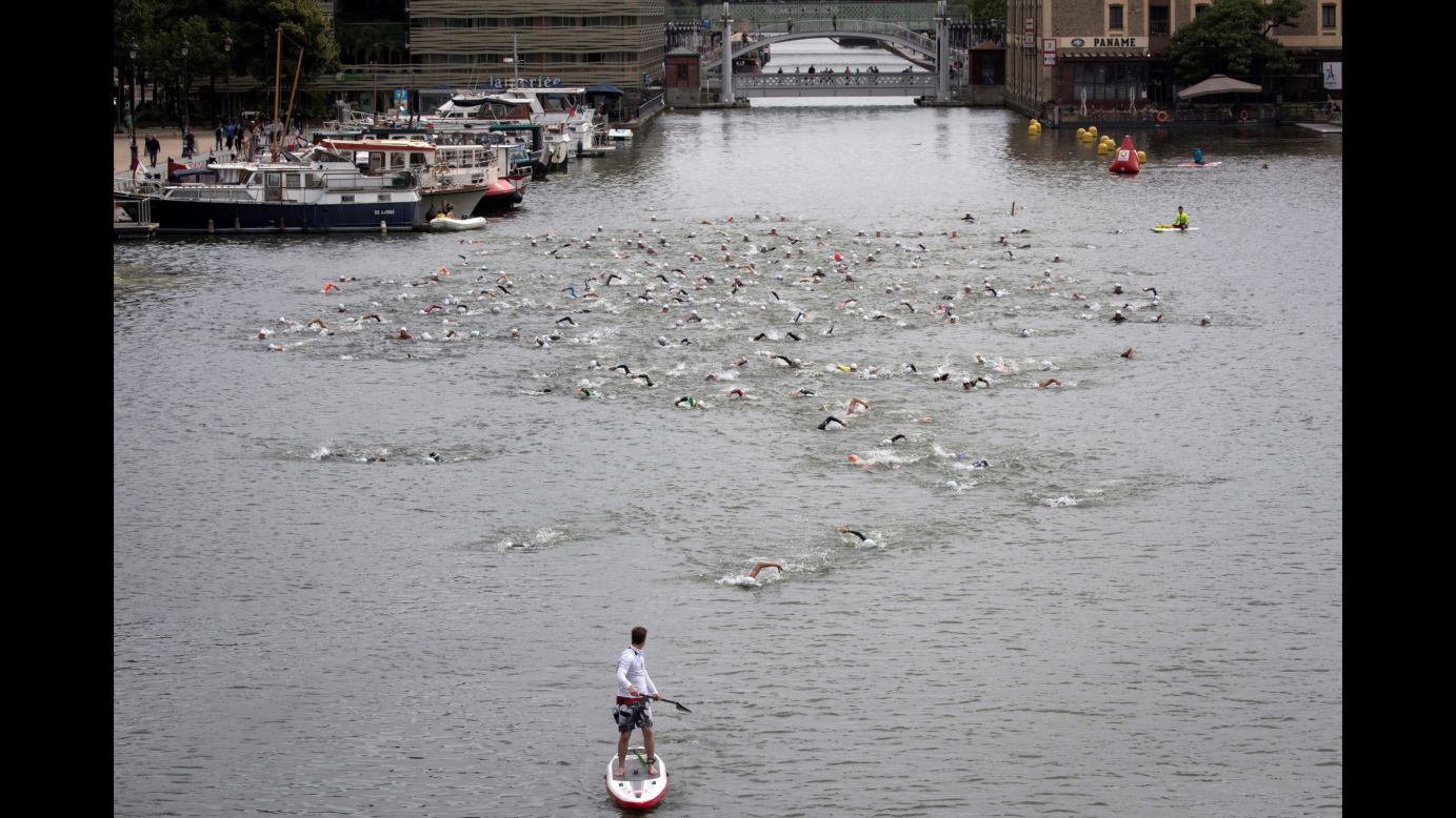 Swimmers take part in the Open Swim Stars event at the Bassin de La Villette in Paris on Sunday, June 17.