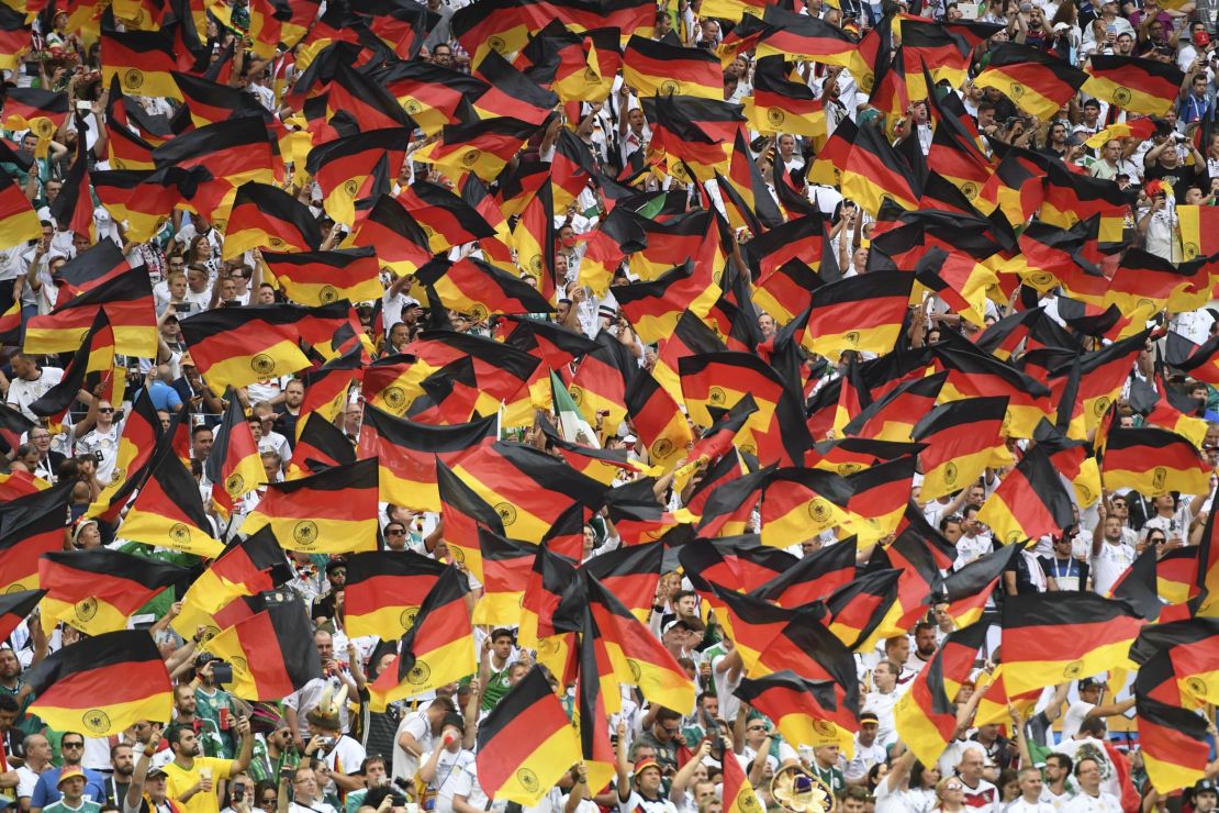 Germany's fans wave their national flag they cheer prior to their team's World Cup Group F football match against Mexico at the Luzhniki Stadium in Moscow.