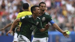 Mexico's forward Hirving Lozano (C) celebrates after opening the scoring against Germany.