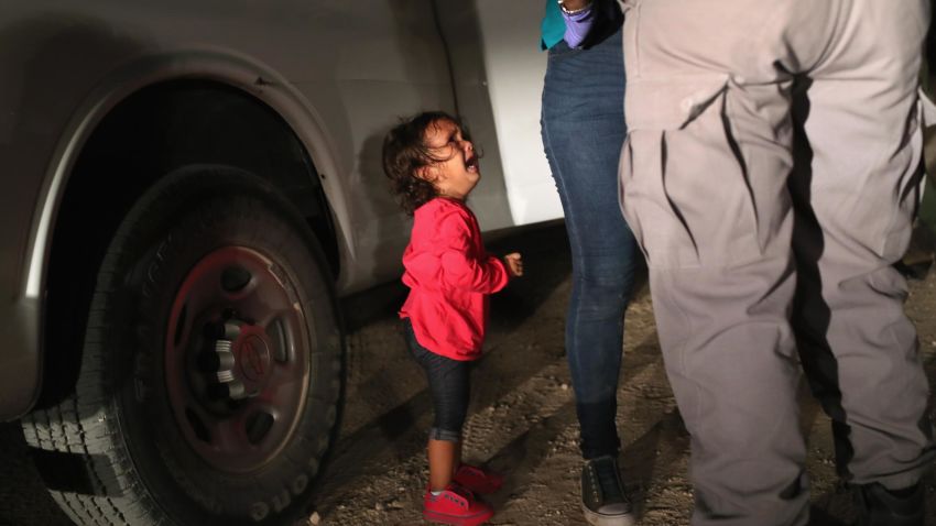 MCALLEN, TX - JUNE 12: A two-year-old Honduran asylum seeker cries as her mother is searched and detained near the U.S.-Mexico border on June 12, 2018 in McAllen, Texas. The asylum seekers had rafted across the Rio Grande from Mexico and were detained by U.S. Border Patrol agents before being sent to a processing center for possible separation. Customs and Border Protection (CBP) is executing the Trump administration's "zero tolerance" policy towards undocumented immigrants. U.S. Attorney General Jeff Sessions also said that domestic and gang violence in immigrants' country of origin would no longer qualify them for political asylum status. (Photo by John Moore/Getty Images)