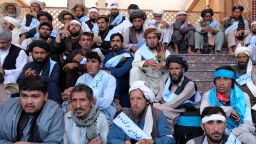Members of the Helmand Peace March sit with supporters and well-wishers from Kabul.