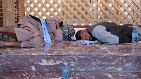 Two of the marchers rest in the Abdul Rahman mosque in Kabul. Mosques were the marchers' chief refuge during their 700-kilometer (435-mile), 38-day trek.