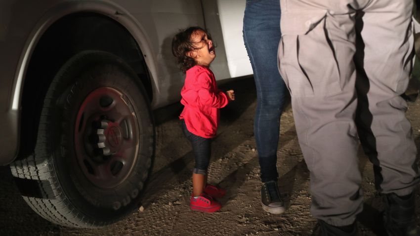 MCALLEN, TX - JUNE 12:  A two-year-old Honduran asylum seeker cries as her mother is searched and detained near the U.S.-Mexico border on June 12, 2018 in McAllen, Texas. The asylum seekers had rafted across the Rio Grande from Mexico and were detained by U.S. Border Patrol agents before being sent to a processing center for possible separation. Customs and Border Protection (CBP) is executing the Trump administration's "zero tolerance" policy towards undocumented immigrants. U.S. Attorney General Jeff Sessions also said that domestic and gang violence in immigrants' country of origin would no longer qualify them for political asylum status.  (Photo by John Moore/Getty Images)