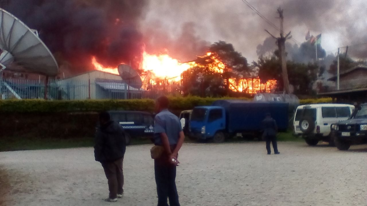 A building is seen on fire during riots in Papua New Guinea's Southern Highlands province.