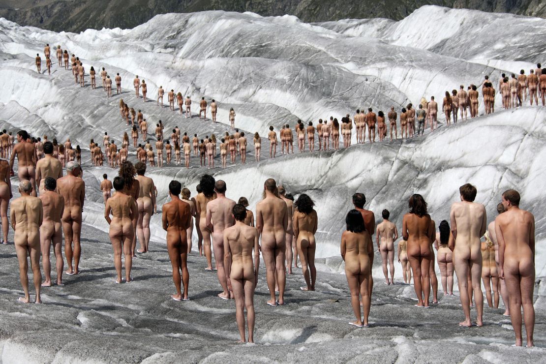 Naked volunteers pose for Tunick in the Swiss glacier of Aletsch, the largest in the Alps, as background for an environmental Greenpeace campaign about global warming on August 18, 2007. 