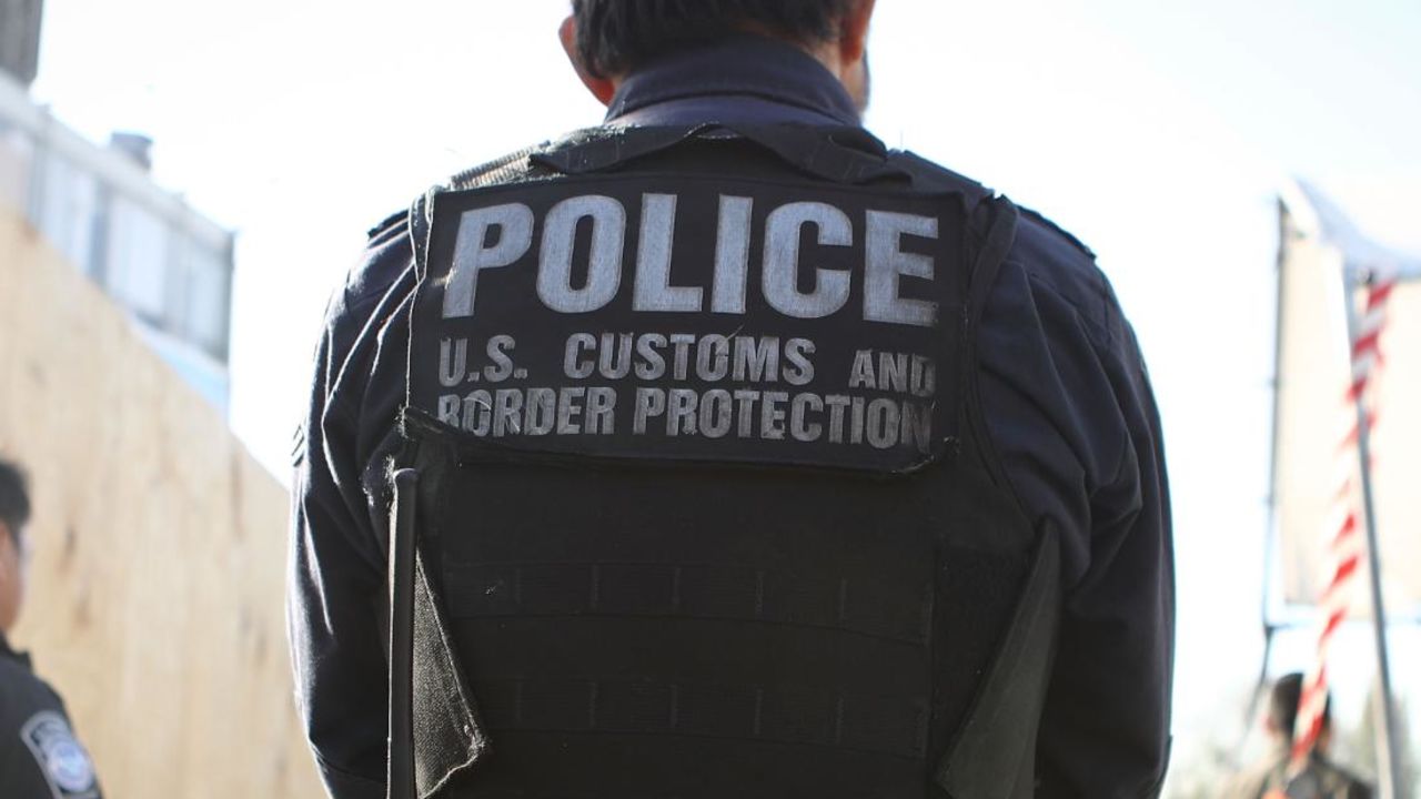 SAN YSIDRO, CA - APRIL 09:  A U.S. Customs and Border Protection officer waits for pedestrians entering the United States at the San Ysidro port of entry on April 9, 2018 in San Ysidro, California. President Trump has issued a decree for the National Guard to guard the 3,200 kilometer border between the United States and Mexico.  (Photo by Mario Tama/Getty Images)